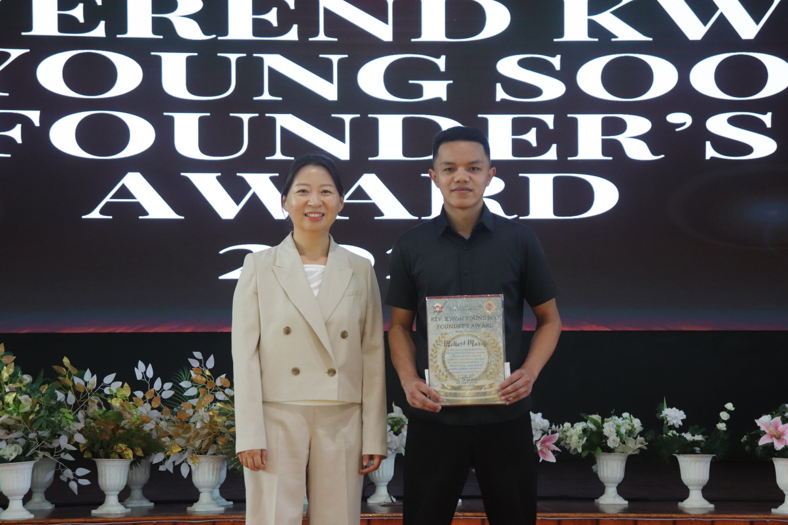 Melbert P. Marafo accepting the Rev. Kwon Young Soo Founder’s Award – servant leadership and tech innovation